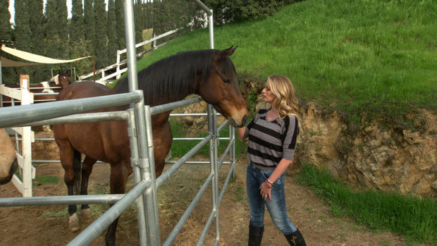 Stormy Daniels at her suburban Texas home. When she's not filming in L.A., she rides her horse daily and teaches her daughter to ride.